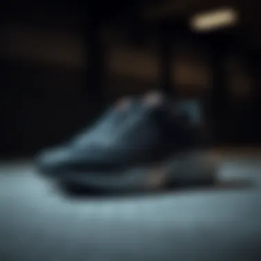 A close-up view of a stylish pair of Armour sports shoes on a textured surface.