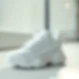 Stylish white baby sports shoes displayed on a clean surface.