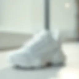 Stylish white baby sports shoes displayed on a clean surface.