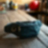 Stylish waist bag on a rustic wooden table