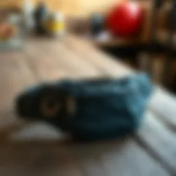 Stylish waist bag on a rustic wooden table