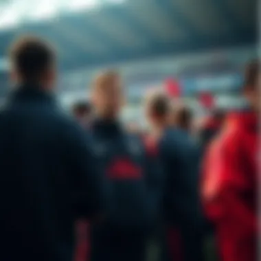 Group of fans wearing Nike PSG tracksuit at a football match