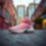 Stylish pink Lebron 19 sneakers on a vibrant urban background
