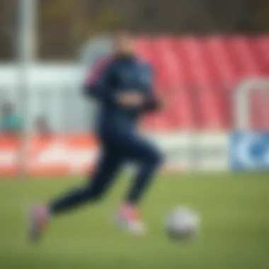 Dynamic action shot of a player wearing Nike PSG tracksuit during practice