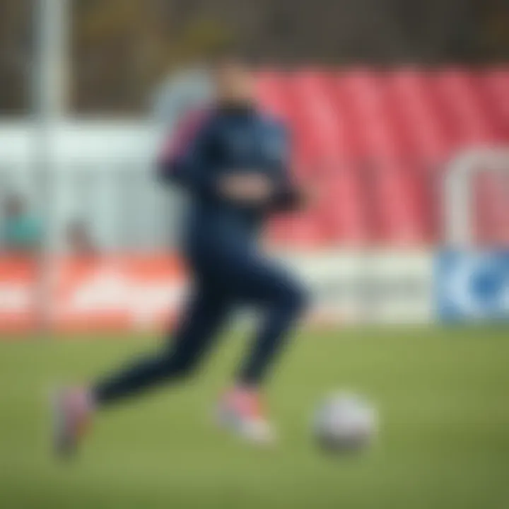 Dynamic action shot of a player wearing Nike PSG tracksuit during practice