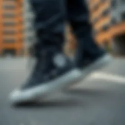 Stylish black high-top Converse sneakers on a modern urban background