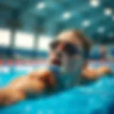 A swimmer using a nose clip while diving into the pool